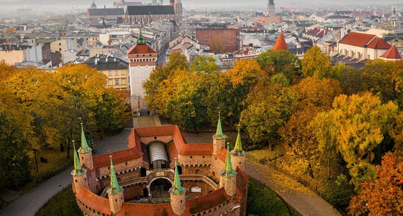 Barbican and Old Town in Krakow in autumn scenery St. Florian's Gate in autumn scenery, Cracow, Poland.
