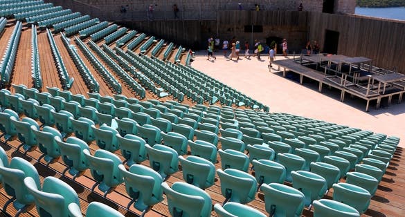 Photo of tourists visiting St. Michael's Fortress, landmark in Sibenik, Croatia.