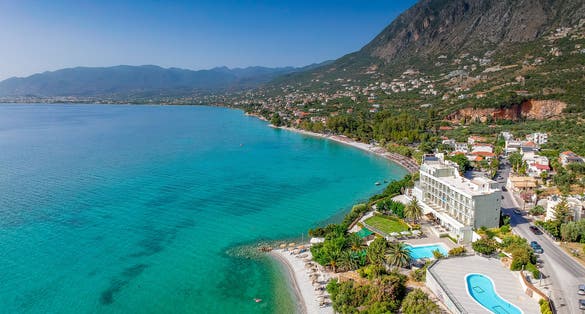 Photo of Aerial seaside view of Almyros beach and luxurious seside hotels in Kalamata, Messenia, Greece.