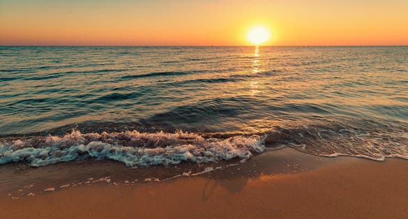 Photo of fig Tree Bay sandy beach at sunset in Protaras.