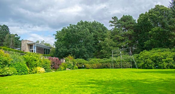 Photo of Yorkshire sculpture park, garden, "no borders just horizons only freedom" sign, Wakefield, England.