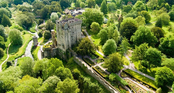 photo of view of Blarney Castle, medieval stronghold in Blarney, near Cork, known for its legendary world-famous magical Blarney Stone aka Stone of Eloquence, and renowned awe Blarney Gardens. County Cork, Ireland.