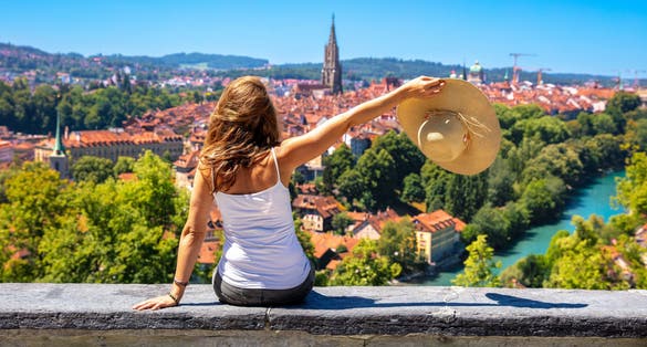 Photo of tourist girl enjoying the scenic view of Bern, Switzerland.