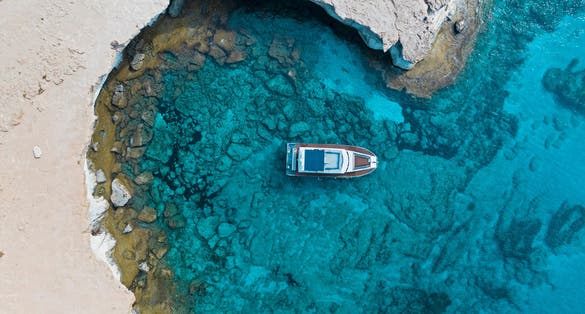 Photo of aerial photography Cape Cavo Greco boat. Mediterranean Sea. Cyprus Ayia Napa Protaras.