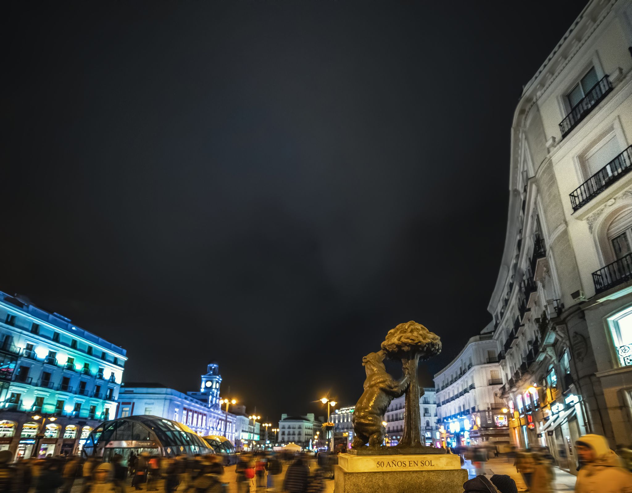 photo of Bear and strawberry tree statue in Puerta del Sol at night. Madrid, Spain.