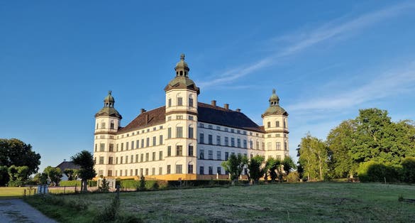 photo of Skokloster castle illuminated by the setting sun Sweden.