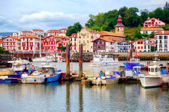 Traditional half-timbered basque houses in port of St Jean de Luz, on the atlantic coast of France