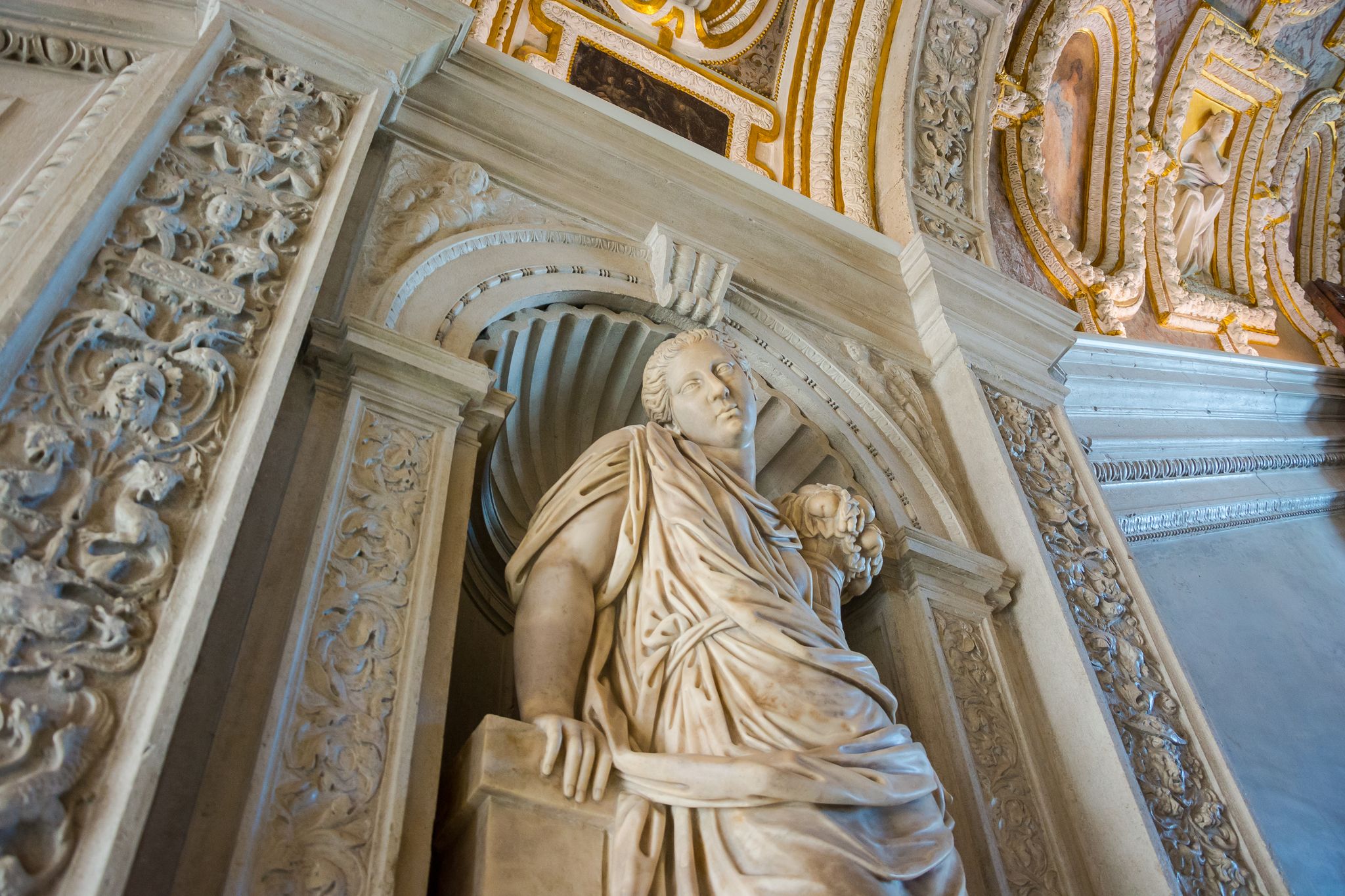 photo of Sculpture in the Doge's Palace, the rich interior decoration of the walls and ceiling. Venice, Italy.