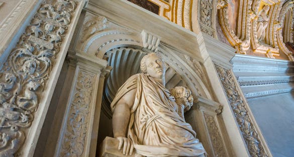 photo of Sculpture in the Doge's Palace, the rich interior decoration of the walls and ceiling. Venice, Italy.