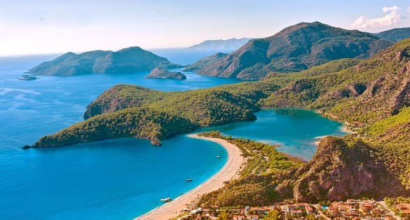 Photo of Oludeniz beautiful beach with blue sky on a sunny day Fethiye, Mugla.