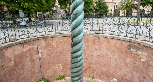photo of The Greek Serpent Column from above also known as the Serpentine Column, Delphi Tripod or Plataean Tripod is an ancient bronze column at the Hippodrome of Constantinople, Istanbul, Turkey.