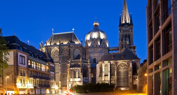 photo of view of Square version of the cathedral of Aachen, Germany with night blue sky. Aachen, Germany.