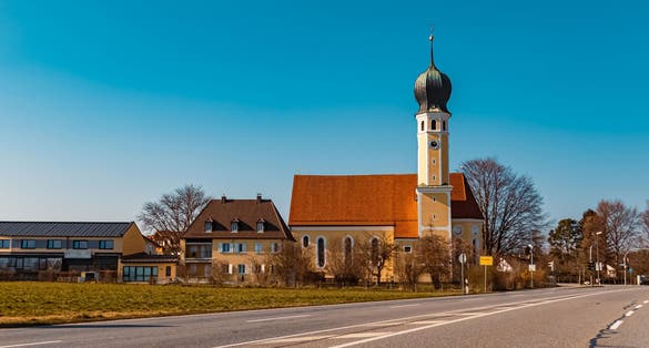 Beautiful church with a cloudless blue sky at Rosenheim, Bavaria, Germany