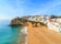 Photo of Carvoeiro fishing village with beautiful beach and colourful houses, Portugal.