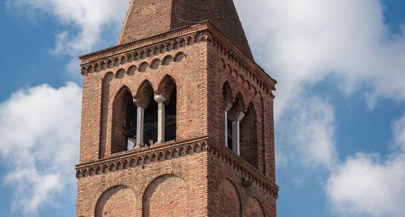 photo of view Bell tower of the Church of San Gregorio Magno, one of the oldest churches in Ferrara (X century), Emilia-Romagna, Italy.