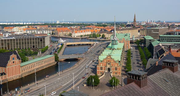 Photo of aerial view of the Stock Exchange "Børsen" imposing, 17th-century, former stock exchange with a striking spire, historical place in the center of Copenhagen, Denmark.