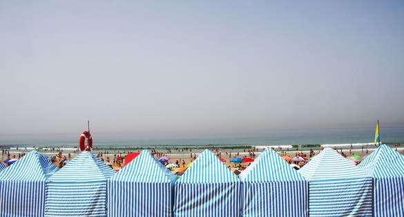Photo of Almada beautiful beach on a sunny day, Portugal.