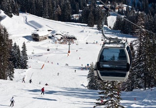 photo of Ski resort Madonna di Campiglio with cable car in Italy.
