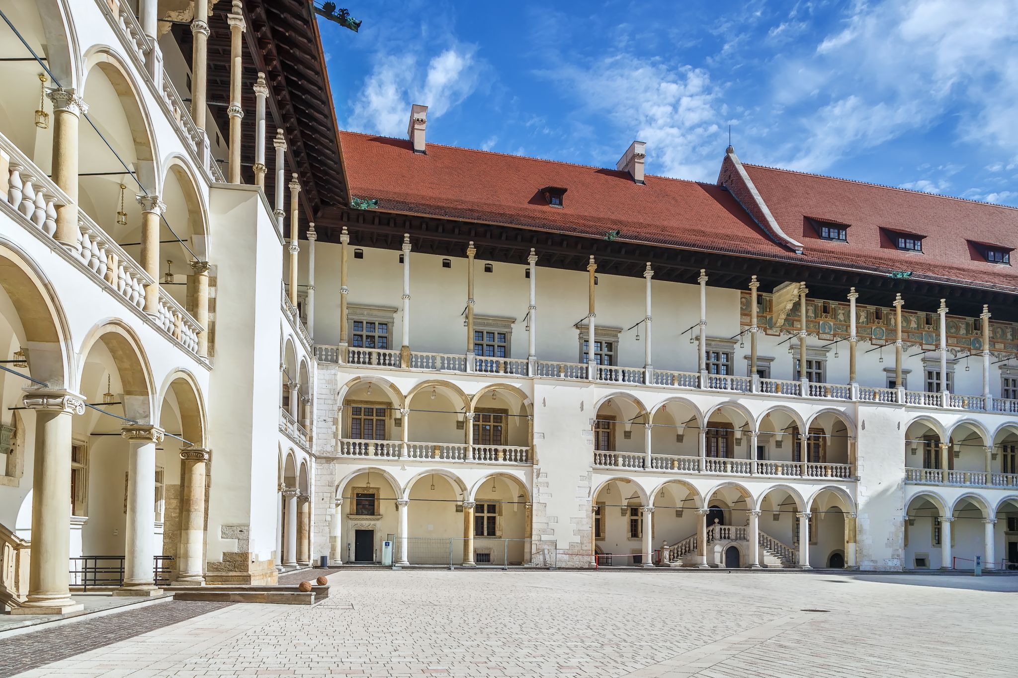 Photo of the tiered arcades of Sigismund I the Old in the Italian Renaissance courtyard within Wawel Castle, Krakow, Poland.