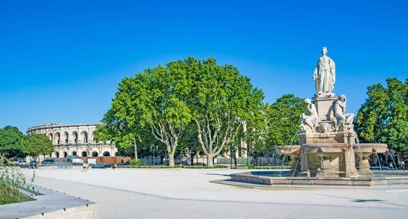 Photo of  Occitanie, Pradier fountain and Arena of Nimes, France.