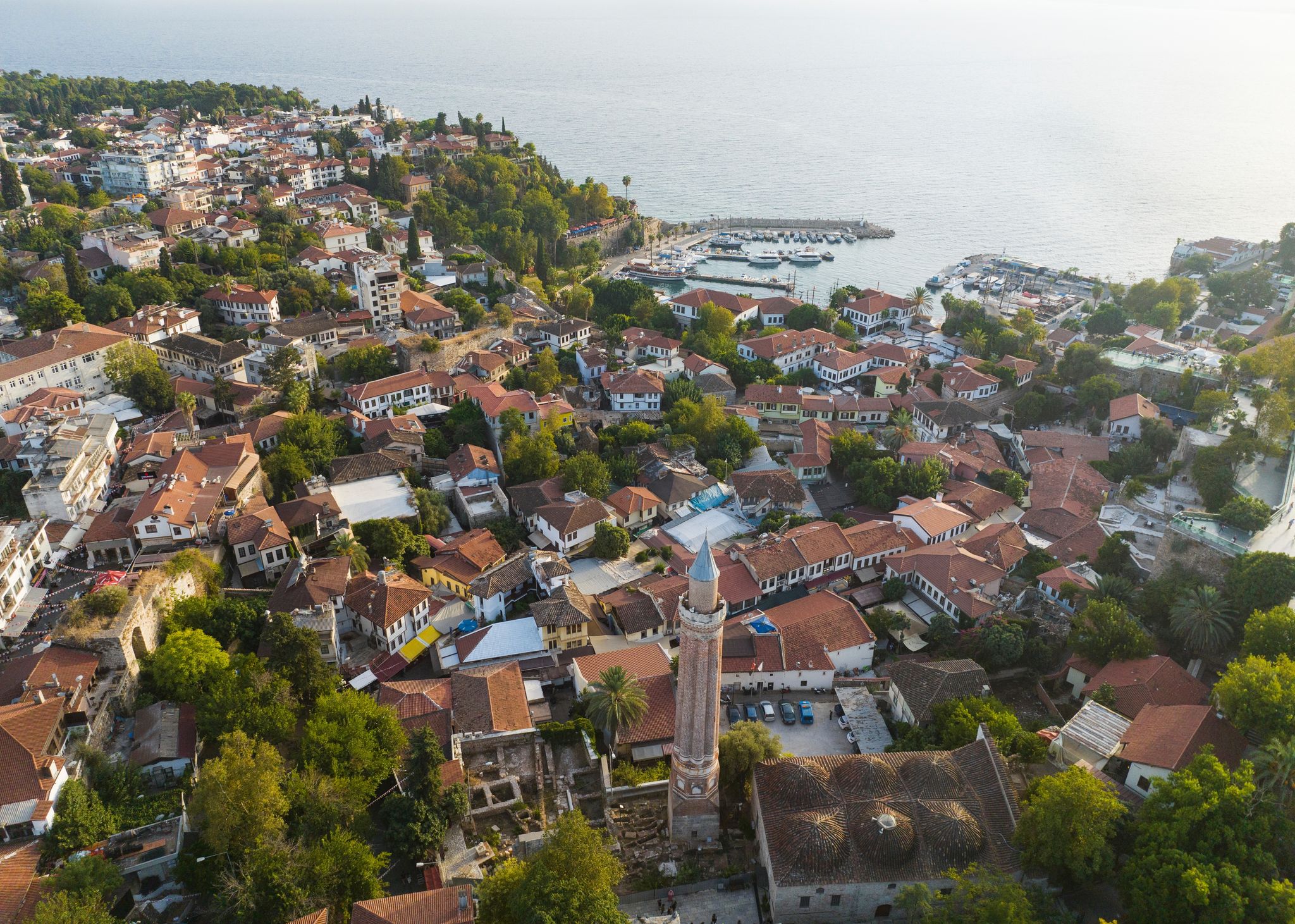photo of drone view of  Kaleici Marina and Yivliminare Mosque in Old town Kaleici in Antalya, Turkey.