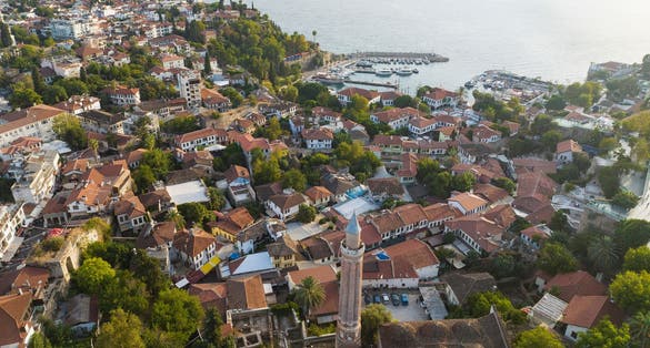 photo of drone view of  Kaleici Marina and Yivliminare Mosque in Old town Kaleici in Antalya, Turkey.