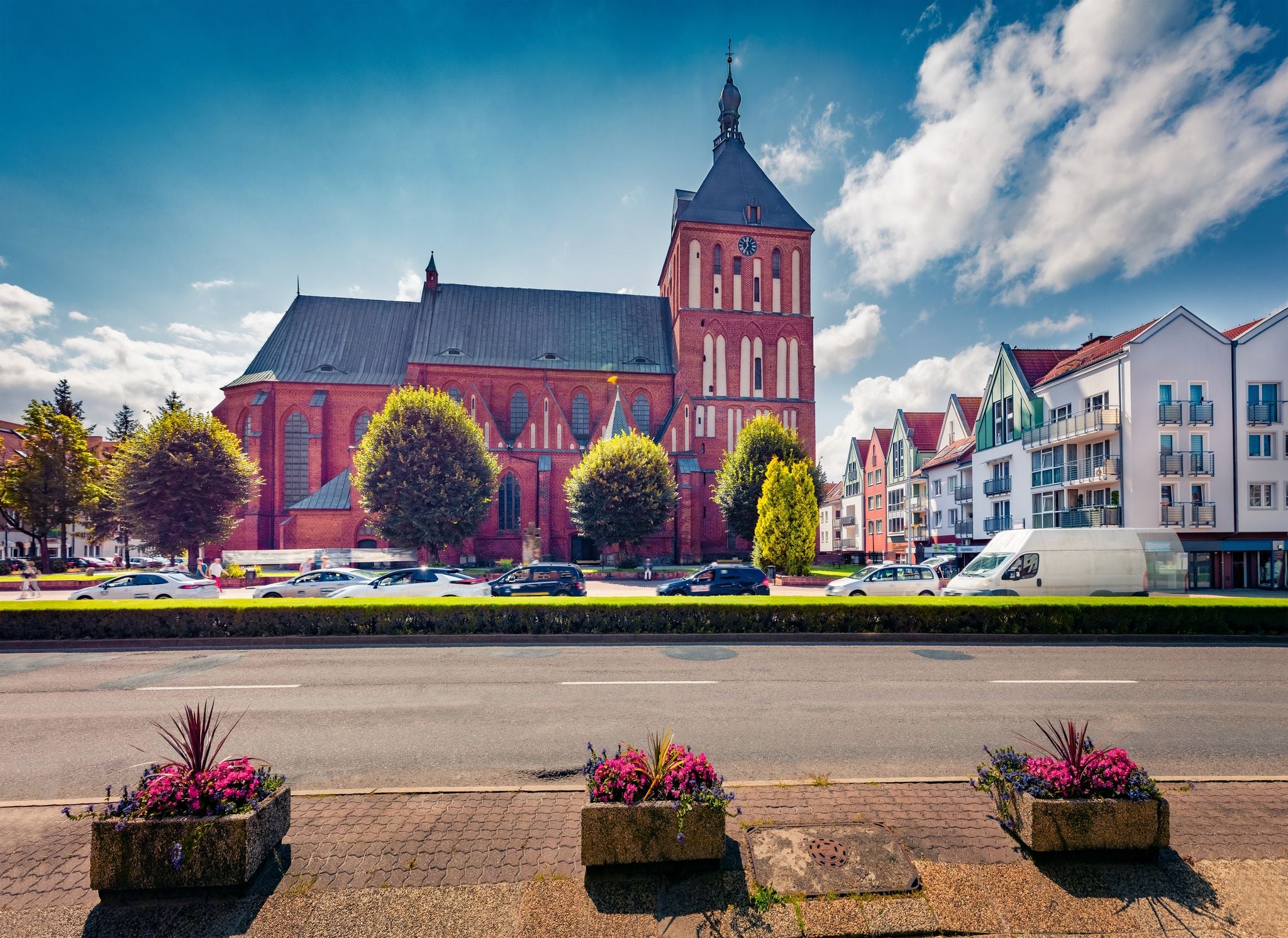Gorgeous summer view of Koszalin Cathedral, Gothic building erected in the years 1300-1333 as a three-nave basilica. Wonderful morning cityscape of Koszalin town, Western Pomerania, Poland.