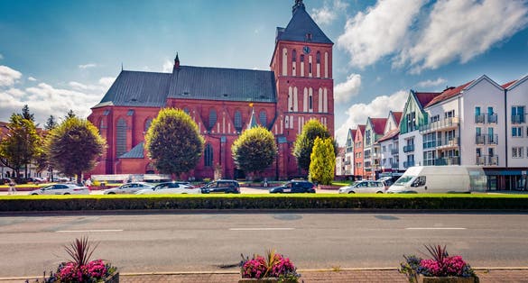 Gorgeous summer view of Koszalin Cathedral, Gothic building erected in the years 1300-1333 as a three-nave basilica. Wonderful morning cityscape of Koszalin town, Western Pomerania, Poland.