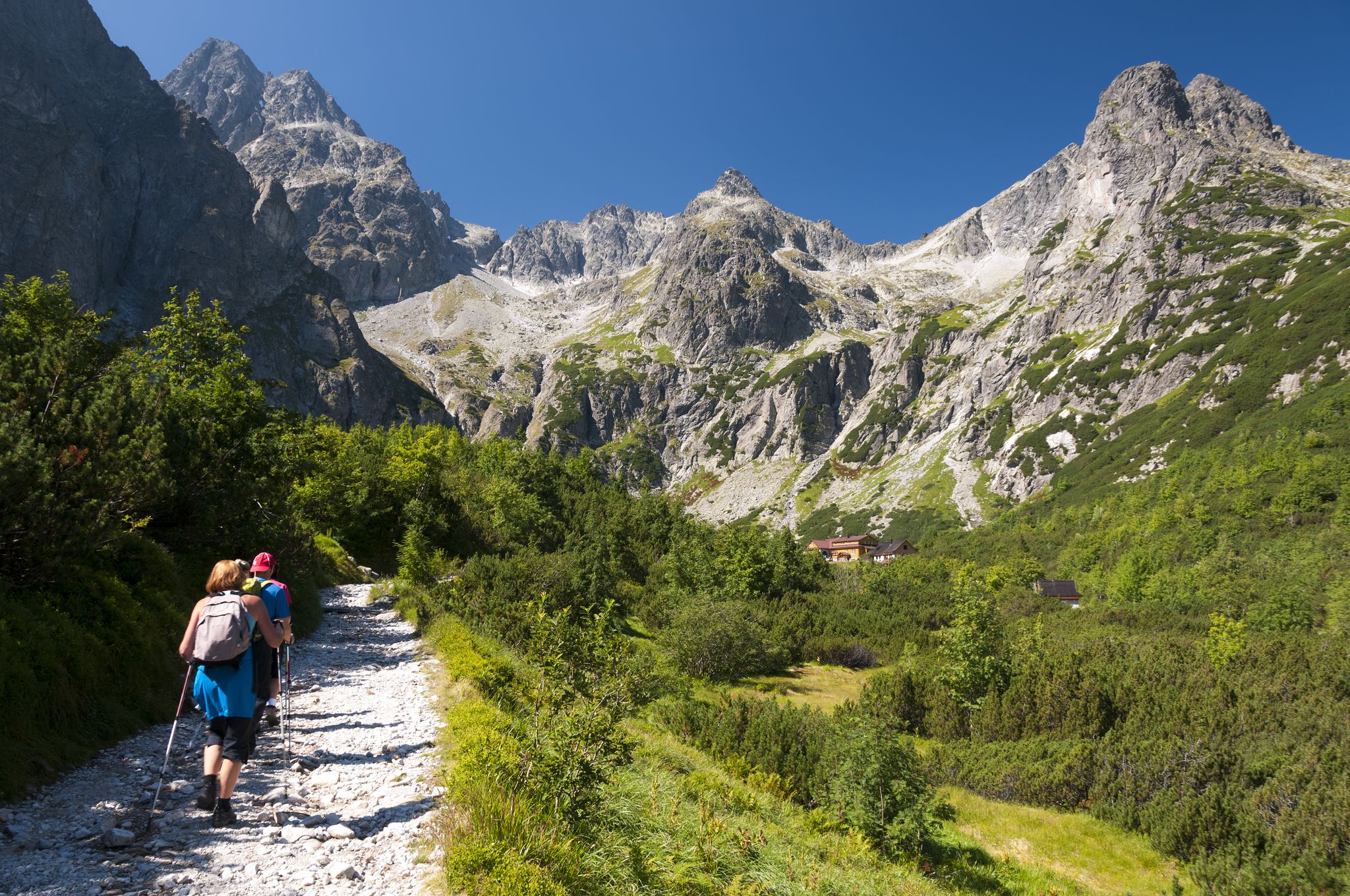 Photo of Tourists approaching to the chalet at Zelene pleso, High Tatras, Slovakia.