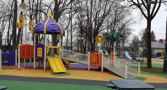Photo of Colorful children's playground in Copou Park,Iasi,Romania .