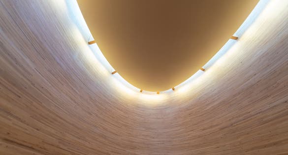 Photo of the interior of Kamppi wooden Chapel at Narinkka Square in Helsinki, Finland.