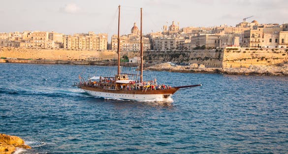 Photo of tourist boat sailing into Sliema, Malta.