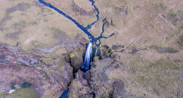 photo of aerial view of gljúfrabúi waterfall in hvolsvöllur, Iceland.