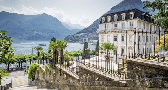 Photo of scenic view of Lugano city, Lugano lake, Switzerland.