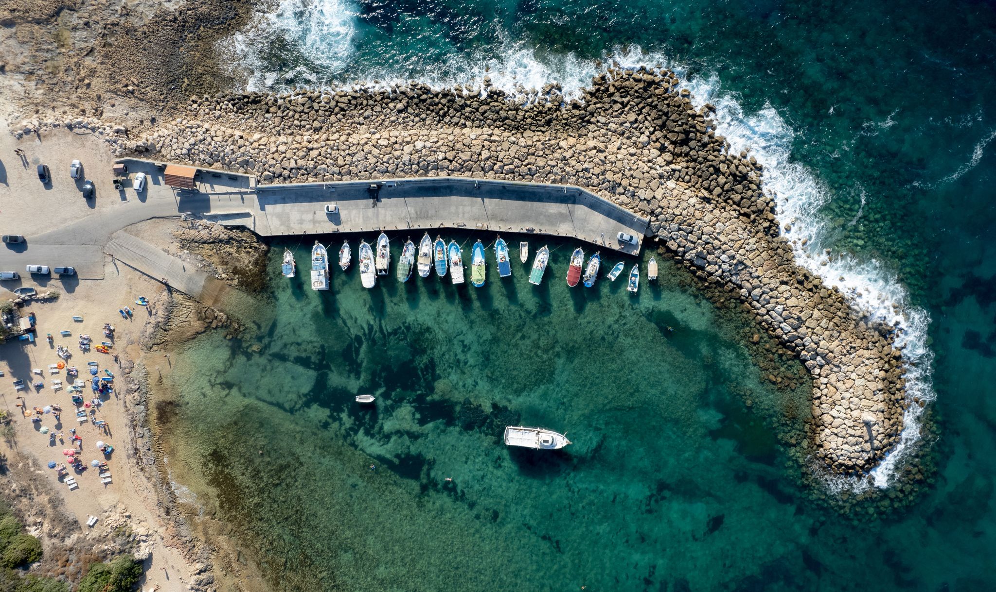 Photo of aerial view on clear blue water of Coral bay in Peyia, Cyprus.