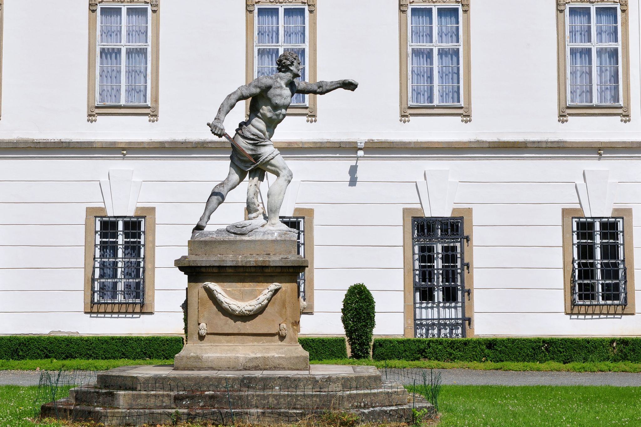 Photo of sculpture gladiator in front of Vizovice castle Czech republic.