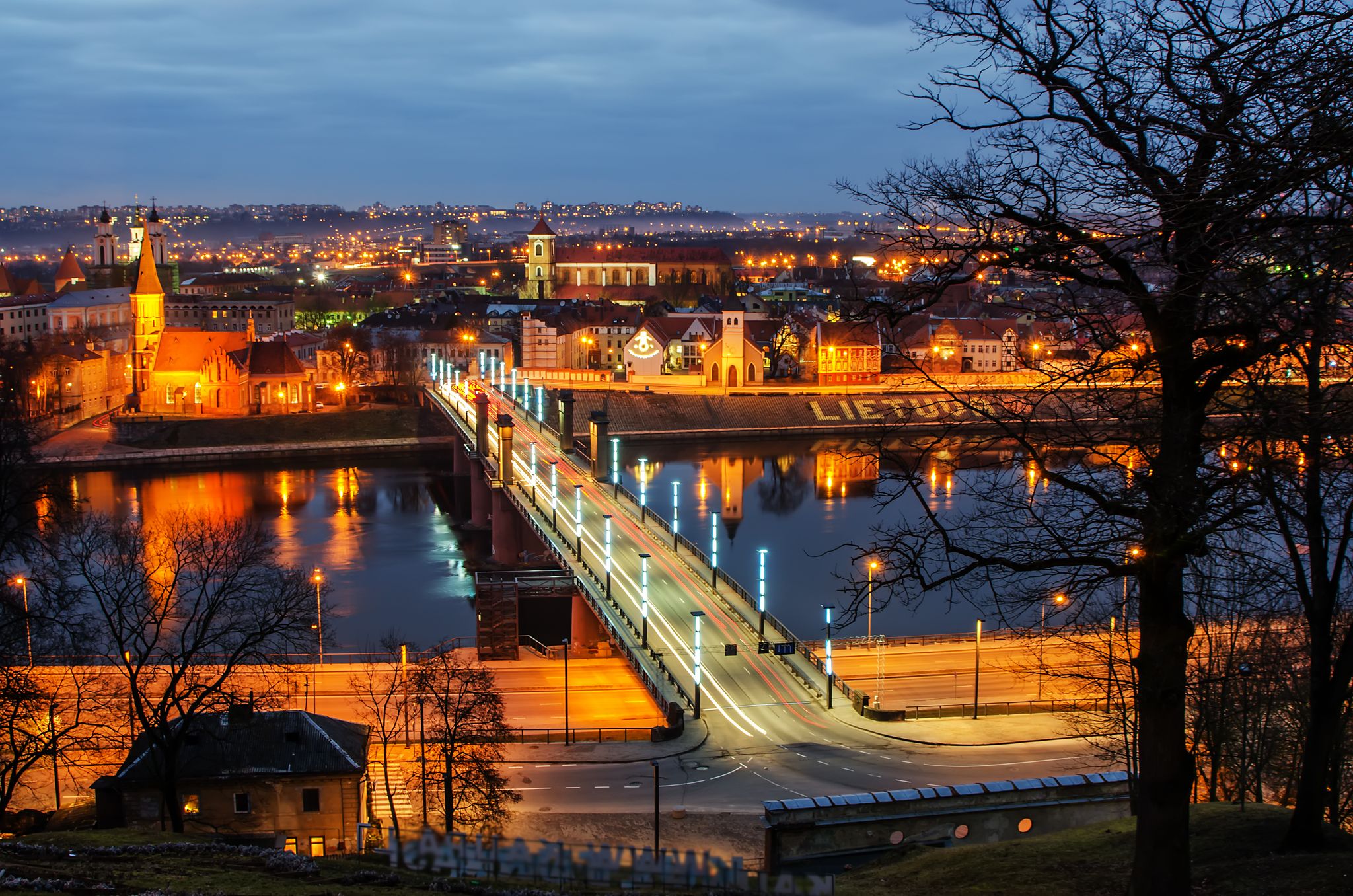 Kaunas, Lithuania: aerial view of Old Town in the beautiful sunset. Vytautas the Great Bridge.