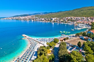 Tourist town of Selce and Poli Mora turquoise beach aerial view, Crikvenica riviera in Croatia