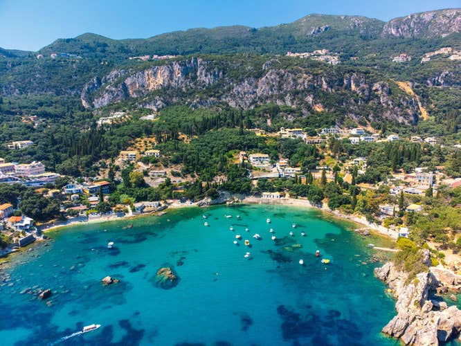 Photo of aerial view of Paleokastritsa with Spiros and Agia triada Beaches in Corfu Greece.