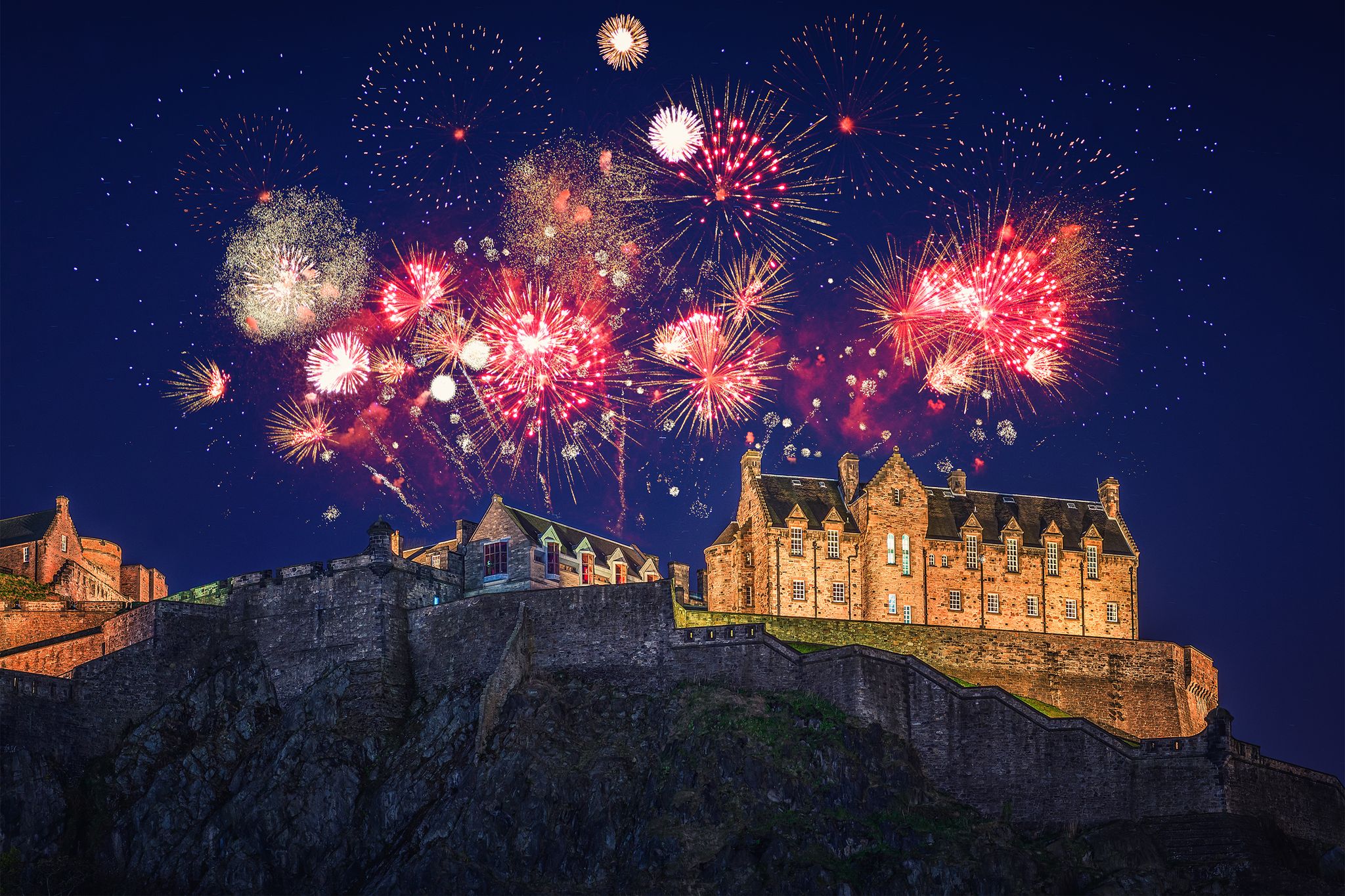 The castle of Edinburgh with fireworks during Hogmanay.