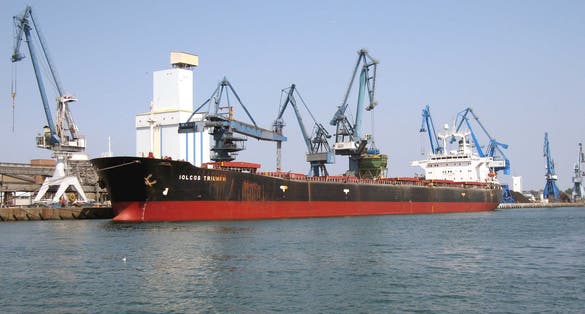 Photo of  Bulk carrier Iolcos Triumph ex Saikai Maru in the commercial port of Lorient unloads soybean meal from Brazil. Lorient, France.