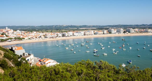 Photo of S. Martinho do Porto, Portugal - September 20, 2018 : Nearly closed sea bay, fine sand beach and clear water Alcobaca, Portugal.
