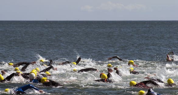 photo of view of Triathlon swimmers inthe open sea, Fredericia, Denmark.