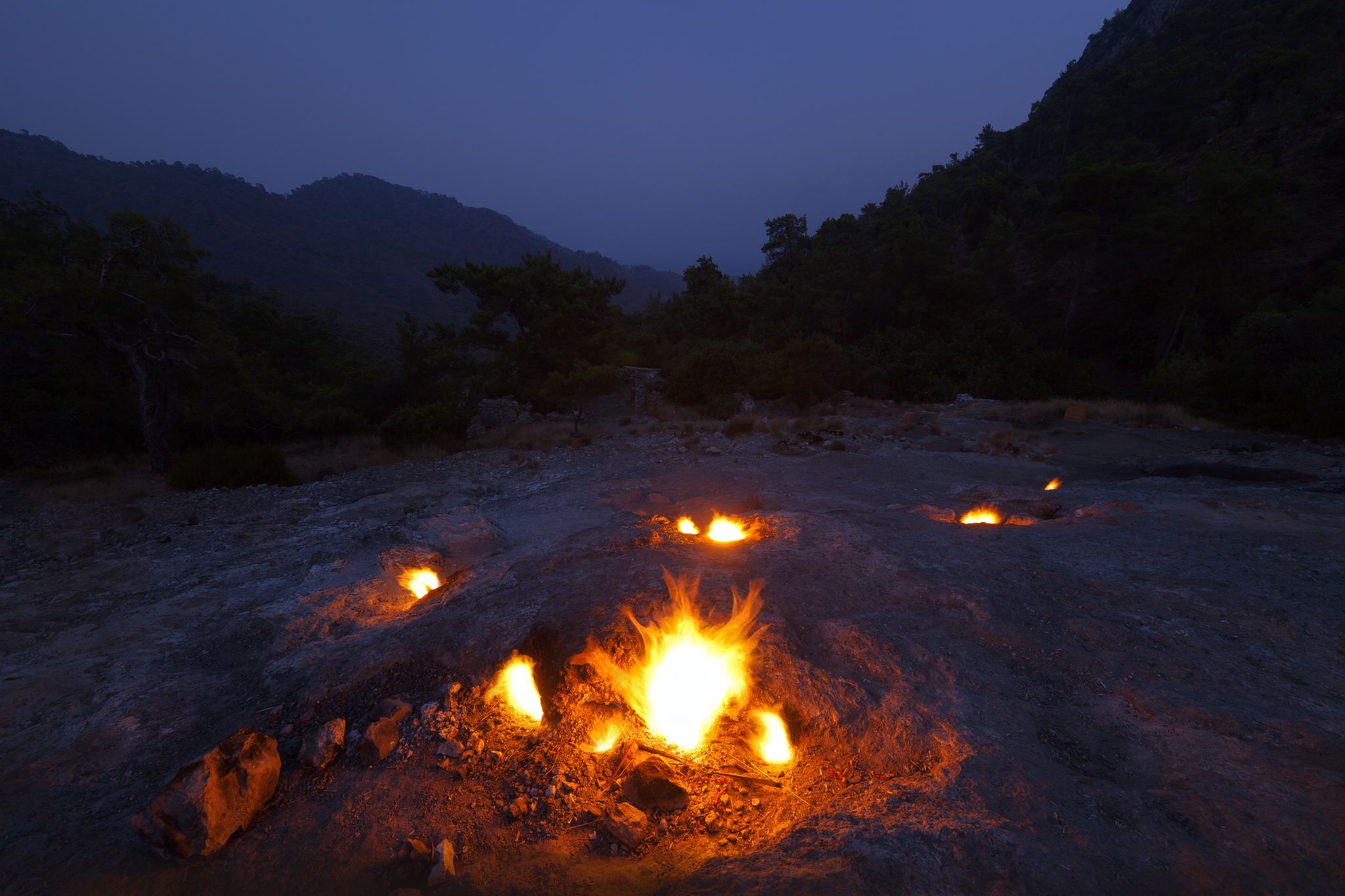 photo of natural fires on the slopes of Mount Chimera at night in Antalya, Turkey.
