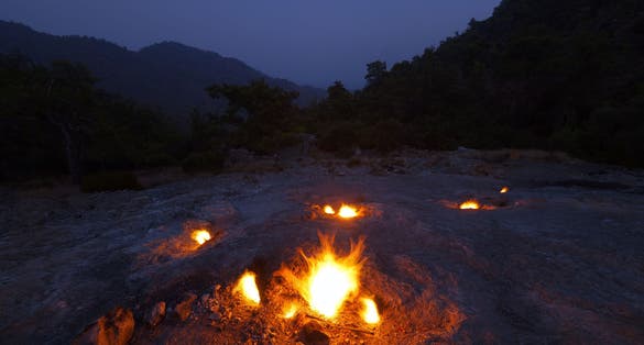 photo of natural fires on the slopes of Mount Chimera at night in Antalya, Turkey.