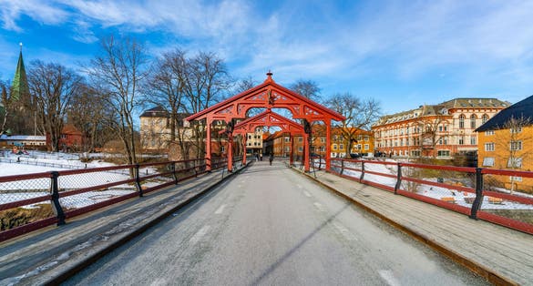 Photo of famous Gamle Bybro (Old Town Bridge) over the river Nidelva in Trondheim, Norway.