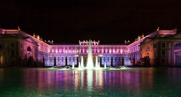 photo of Luxury classical palace illuminated with colourful lights under a dark night sky - Villa Reale di Monza, Royal Villa of Monza, Lombardy, Italy, Europe