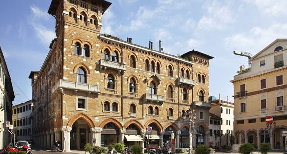 Treviso, Venetien - Italy -Historic red brick building with Romanesque windows, balconies and columns, located in Piazza San Vito, Treviso, Italy