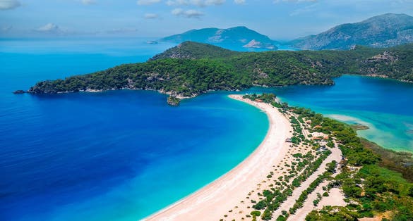 Photo of aerial view beautiful blue Lagoon and beach in Oludeniz Fethiye, Turkey.