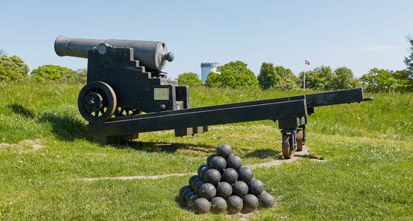 photo of view of Old bronze cannon on rampart in city Fredericia, Denmark.